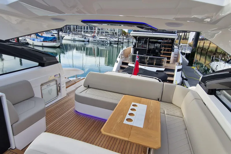 Volvo Ips & Dps Yacht Photos Pics Luxurious 2024 Fairline Targa 45 Open yacht interior with elegant seating and wooden table.