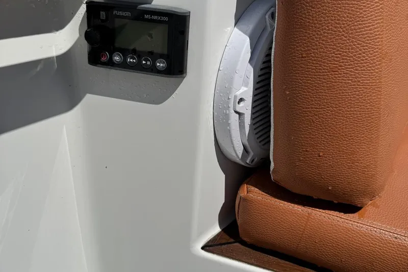  Yacht Photos Pics Fusion MS-NRX300 stereo and speaker on 2017 Fjord 36' Open boat with brown leather seating.