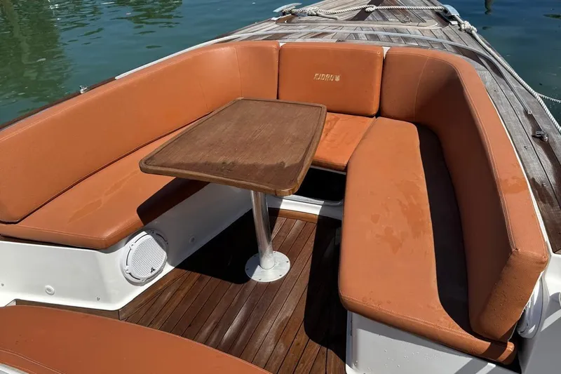  Yacht Photos Pics Luxurious seating area on a 2017 Fjord 36' Open boat with wooden table.