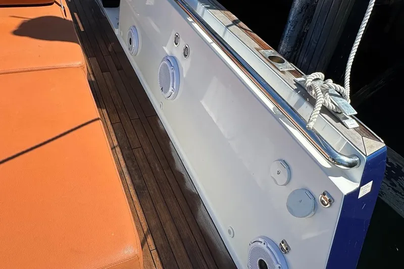  Yacht Photos Pics 2017 Fjord 36' Open yacht deck with orange seating and wood flooring.