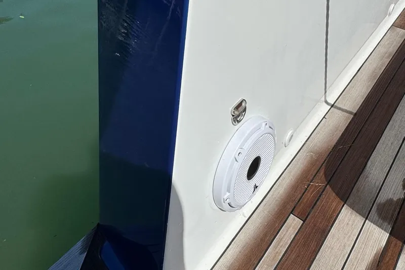  Yacht Photos Pics Side view of a 2017 Fjord 36' Open boat with speaker and wooden deck.