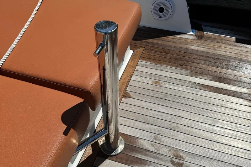  Yacht Photos Pics Brown leather seating and metal post on 2017 Fjord 36' Open boat deck.
