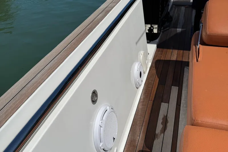  Yacht Photos Pics 2017 Fjord 36' Open boat deck with speakers and orange seating.