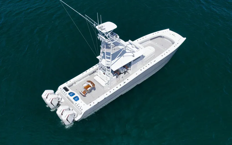  Yacht Photos Pics Aerial view of 2022 Freeman 47 boat on clear blue water.