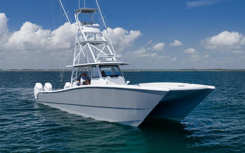  Yacht Photos Pics 2022 Freeman 47 boat on open water under blue sky.