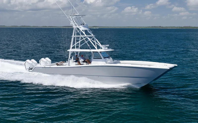  Yacht Photos Pics Freeman 47 boat cruising on open water, 2022 model, under clear skies.