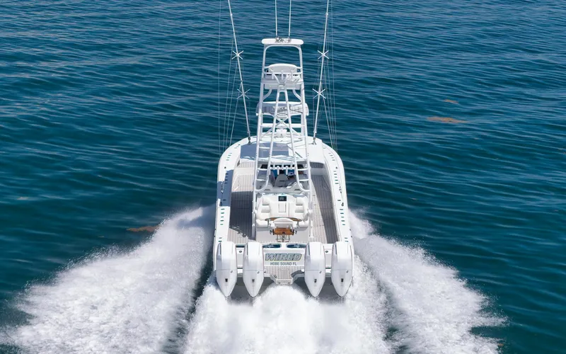  Yacht Photos Pics Freeman 47 boat cruising on open water, 2022 model, rear view.