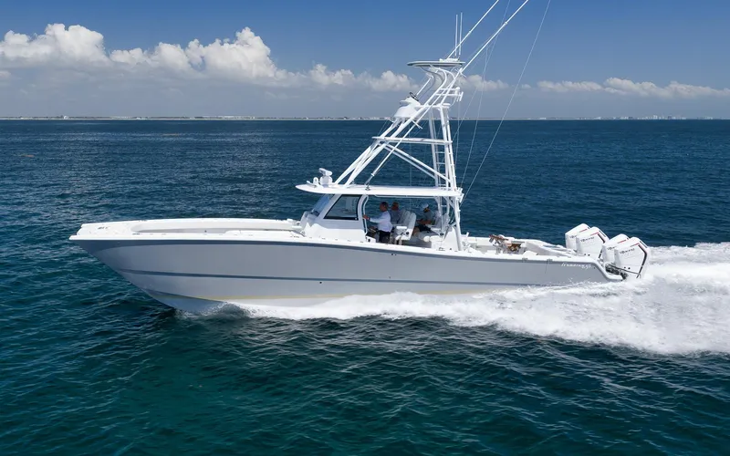  Yacht Photos Pics 2022 Freeman 47 boat cruising on open ocean under clear blue sky.