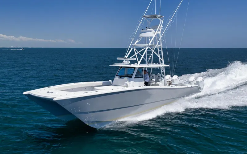  Yacht Photos Pics 2022 Freeman 47 boat cruising on open ocean under clear blue sky.