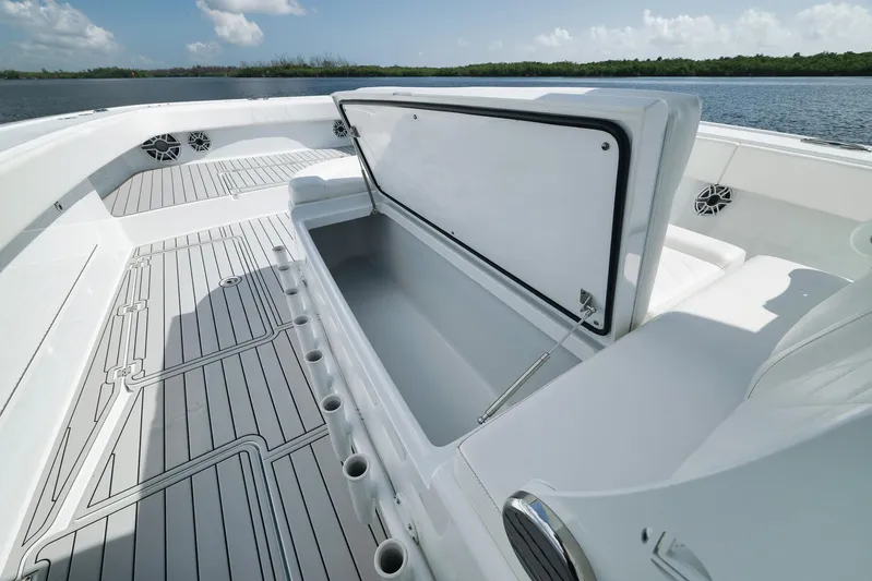  Yacht Photos Pics 2022 Freeman 47 boat interior with open storage compartment, sleek design, and scenic water view.