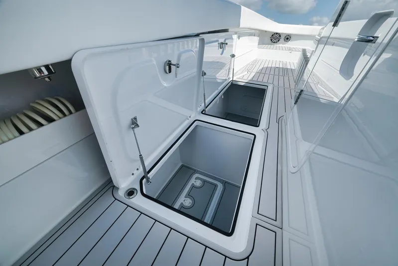  Yacht Photos Pics Open storage compartments on a 2022 Freeman 47 boat deck.