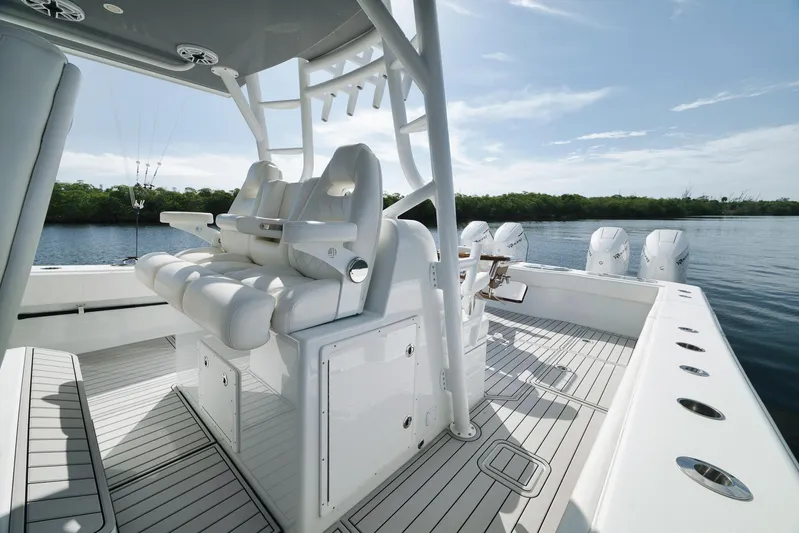  Yacht Photos Pics Luxurious 2022 Freeman 47 boat interior with sleek seating and multiple outboard engines.