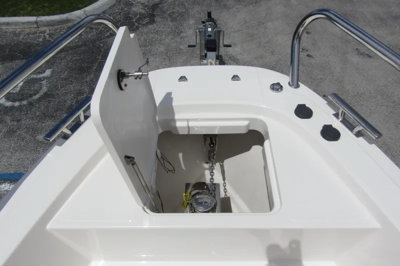  Yacht Photos Pics 2024 Nimbus T8 boat anchor compartment with open hatch and visible chain mechanism.