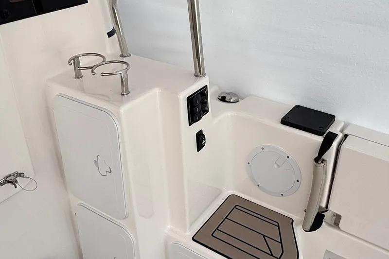  Yacht Photos Pics 2025 Cutwater C-32 CB boat interior with cup holders and storage compartments.