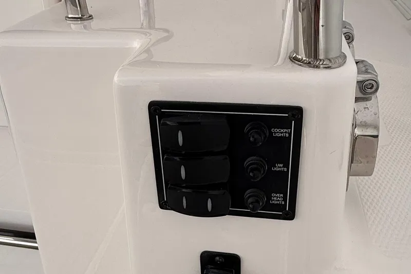  Yacht Photos Pics Control panel on 2025 Cutwater C-32 CB boat, featuring cockpit, underwater, and overhead light switches.