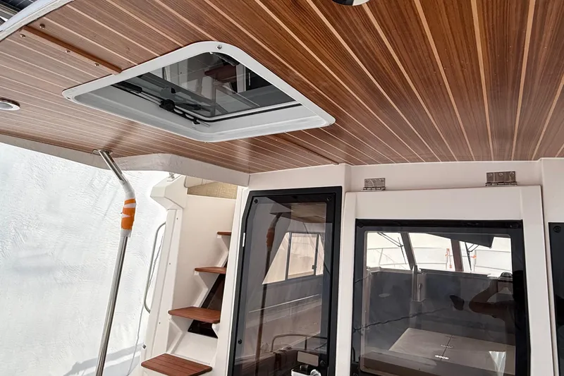  Yacht Photos Pics Interior of 2025 Cutwater C-32 CB boat with wooden ceiling and modern design.