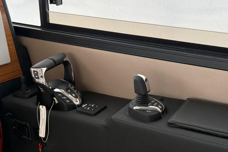  Yacht Photos Pics Control panel of 2025 Cutwater C-32 CB boat with joystick and throttle.