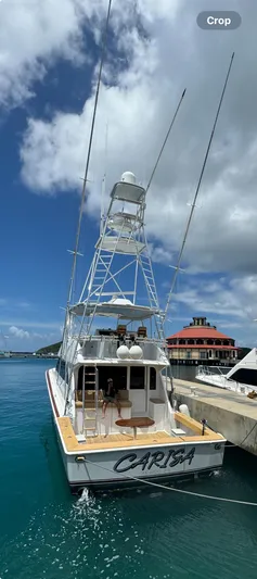 Carisa Yacht Photos Pics 2001 Viking 55 Convertible yacht docked in a sunny marina.