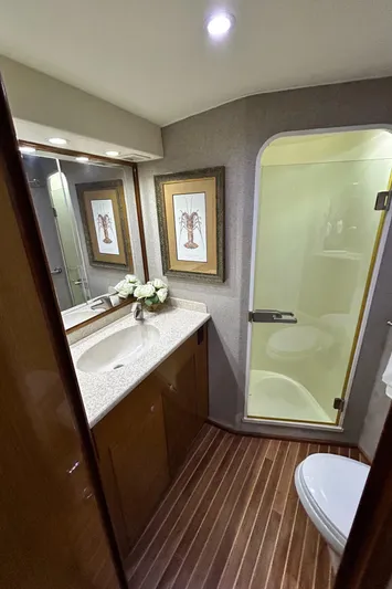 Carisa Yacht Photos Pics Luxurious bathroom in 2001 Viking 55 Convertible yacht with modern fixtures and elegant decor.