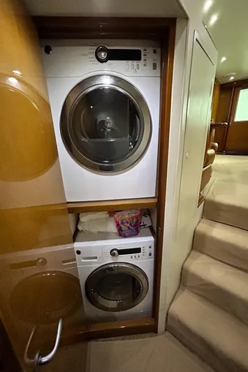 Carisa Yacht Photos Pics Laundry area inside 2001 Viking 55 Convertible yacht with stacked washer and dryer.