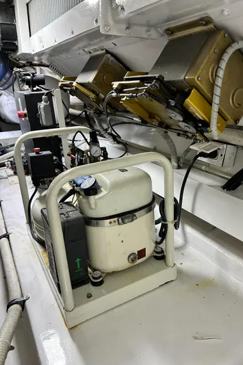 Carisa Yacht Photos Pics Engine room of 2001 Viking 55 Convertible yacht, showcasing mechanical components.