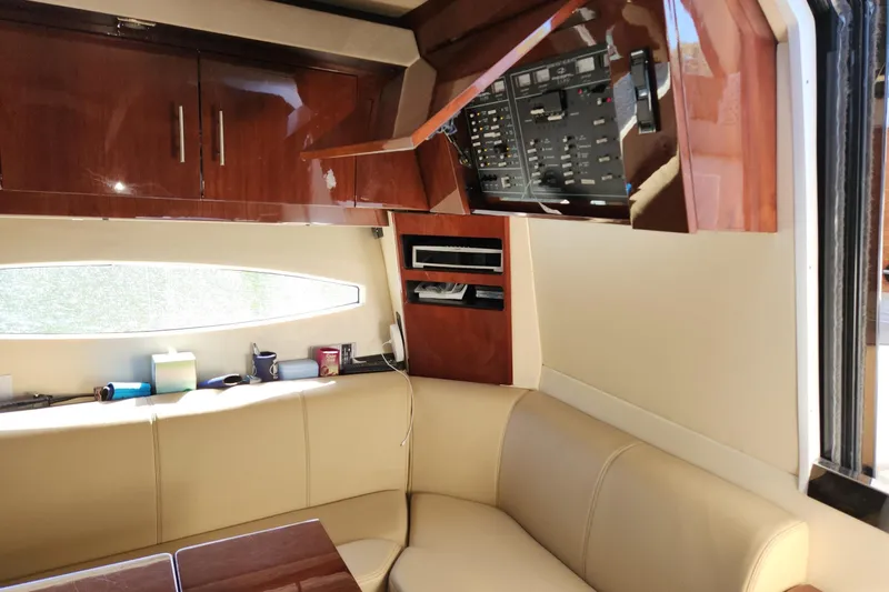 Sea Wolf Yacht Photos Pics Interior of 2013 Regal 42 Sport Coupe with leather seating and control panel.