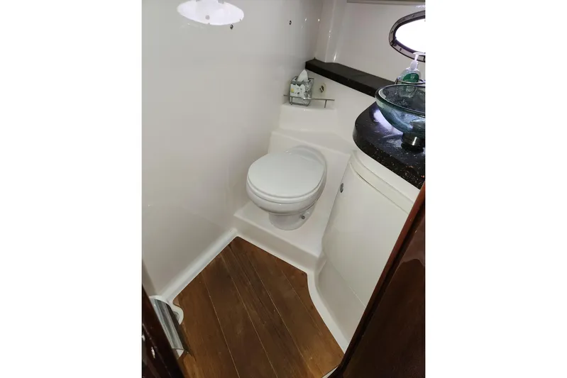 Sea Wolf Yacht Photos Pics 2013 Regal 42 Sport Coupe bathroom with modern fixtures and wooden flooring.