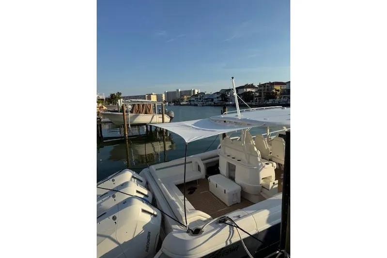  Yacht Photos Pics 2016 Intrepid 475 Panacea boat docked in a scenic marina setting.