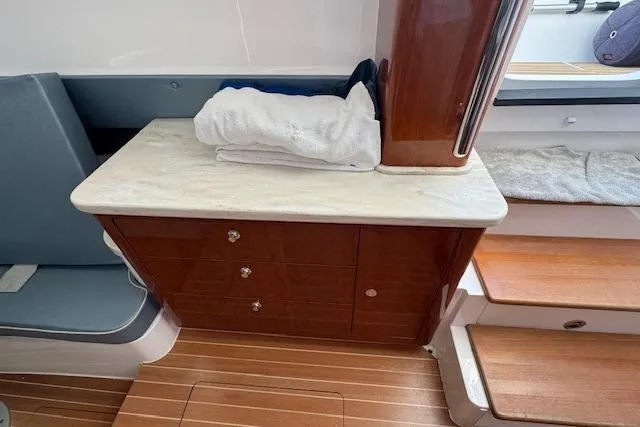  Yacht Photos Pics Interior of 2016 Intrepid 475 Panacea with wooden cabinetry and seating.