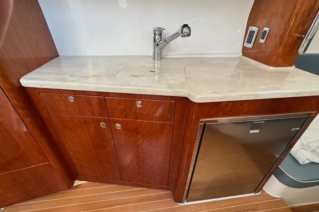  Yacht Photos Pics Luxurious 2016 Intrepid 475 Panacea yacht interior with wooden cabinetry and modern sink.