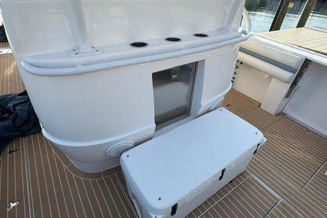  Yacht Photos Pics 2016 Intrepid 475 Panacea boat deck with storage and seating area.