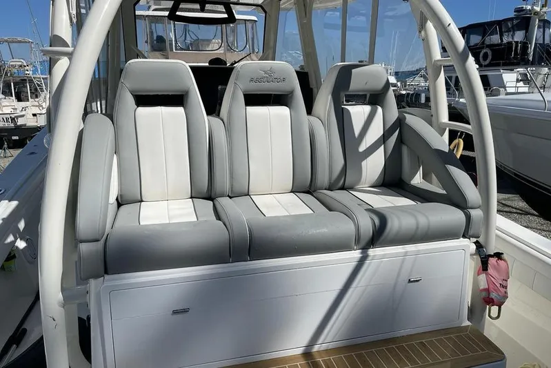  Yacht Photos Pics 2019 Regulator 41 boat seating with gray and white cushioned seats.