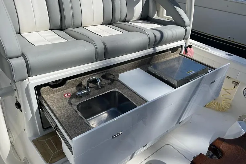  Yacht Photos Pics 2019 Regulator 41 boat interior with sink and seating area.