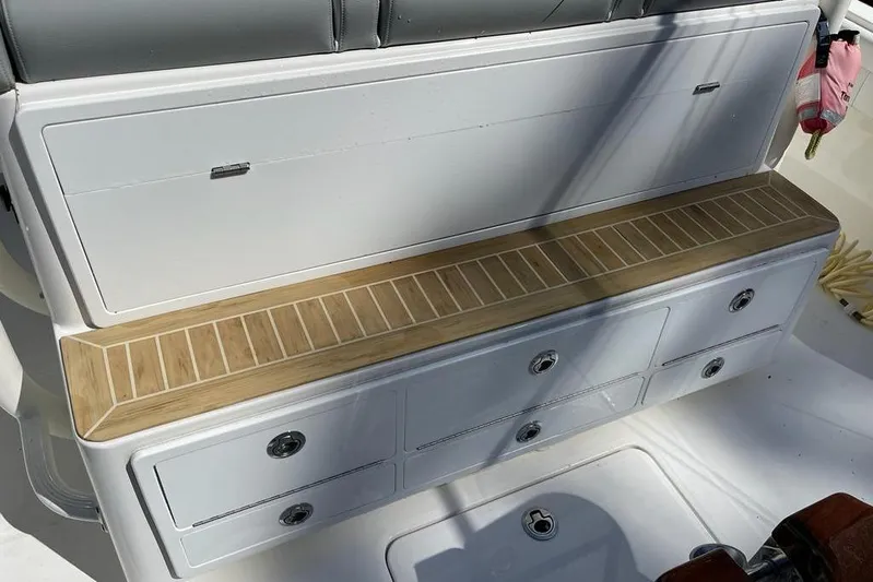  Yacht Photos Pics 2019 Regulator 41 boat interior with storage compartments and cushioned seating.