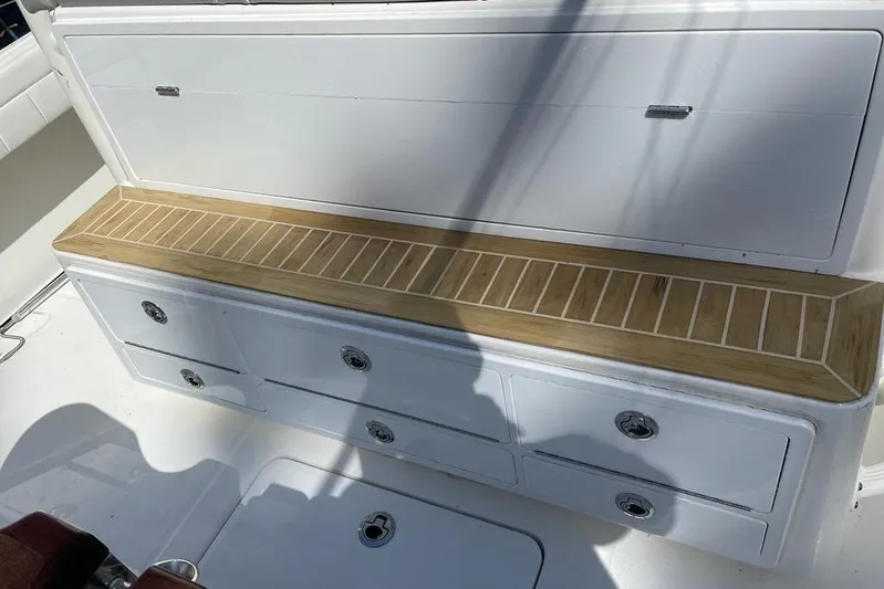  Yacht Photos Pics 2019 Regulator 41 boat interior with white storage drawers and wooden trim.
