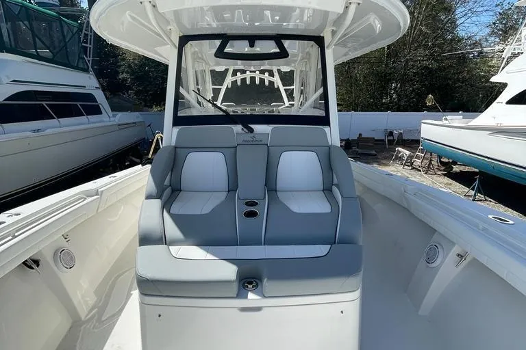  Yacht Photos Pics 2019 Regulator 41 boat interior with dual seating and cup holders.