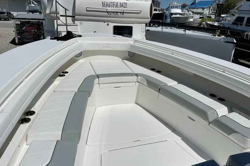  Yacht Photos Pics 2019 Regulator 41 boat with spacious seating area, docked in a marina.