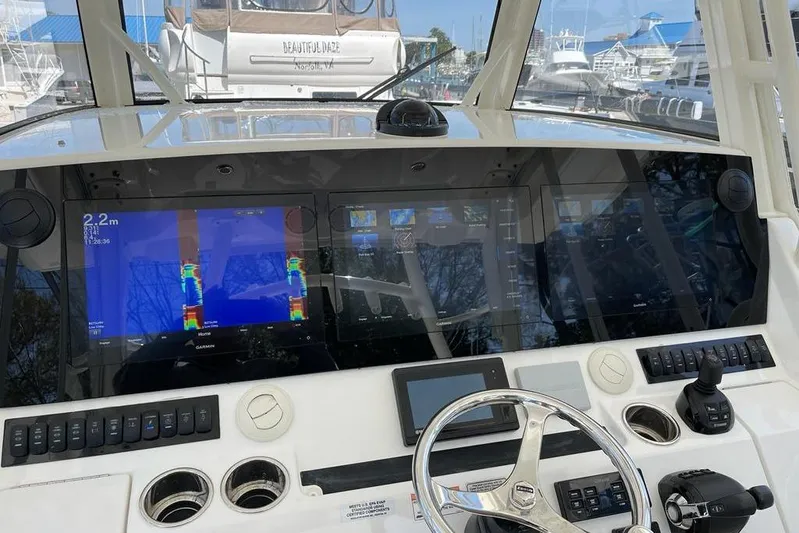  Yacht Photos Pics Control panel of a 2019 Regulator 41 boat with advanced navigation displays.