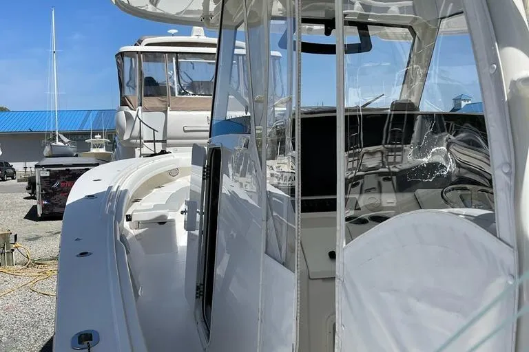  Yacht Photos Pics 2019 Regulator 41 boat interior with sleek design, docked near other vessels.
