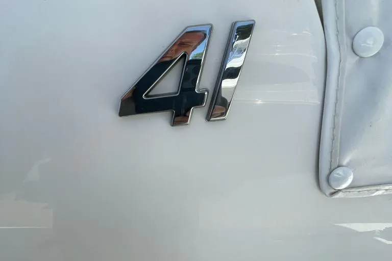  Yacht Photos Pics Chrome "41" emblem on a 2019 Regulator boat, white background.