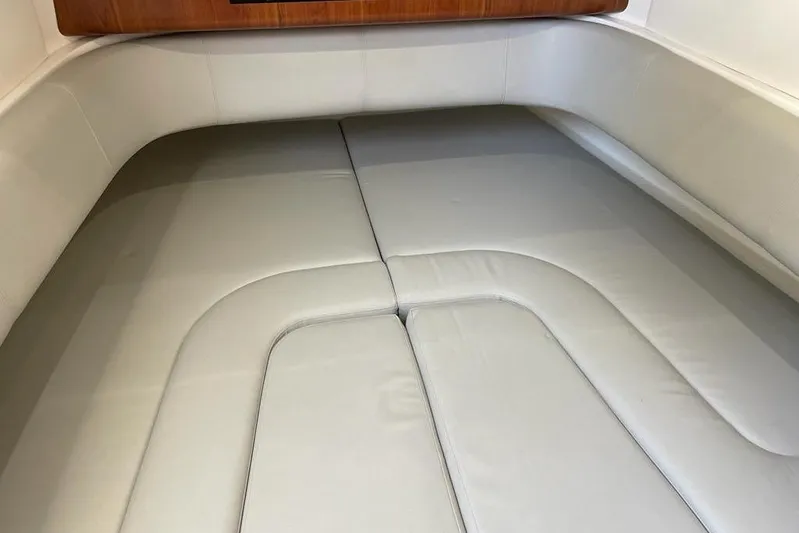  Yacht Photos Pics 2019 Regulator 41 boat interior with cushioned seating area.