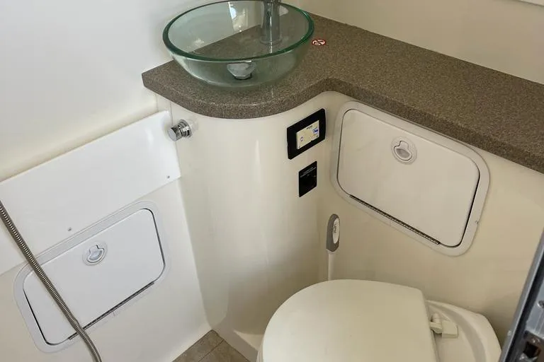  Yacht Photos Pics 2019 Regulator 41 boat bathroom with glass sink and modern fixtures.