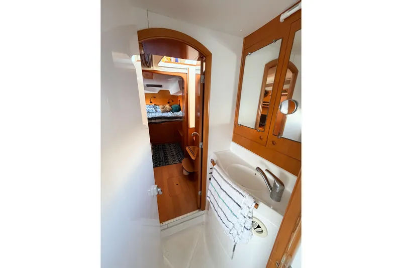 No Ka Oi Yacht Photos Pics Interior of 2005 Lagoon 380 S2 yacht showing bathroom and cabin area.
