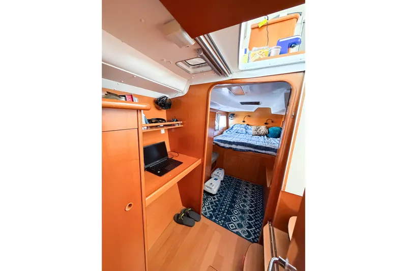 No Ka Oi Yacht Photos Pics Interior of 2005 Lagoon 380 S2 catamaran with cozy cabin and workspace.