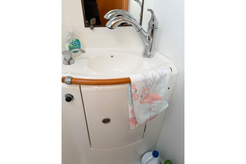 No Ka Oi Yacht Photos Pics Bathroom sink area in 2005 Lagoon 380 S2 yacht with towel and soap.