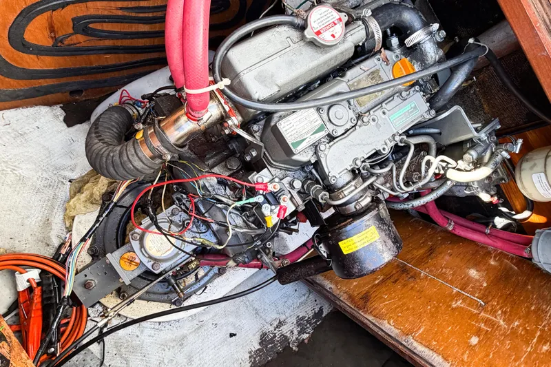 No Ka Oi Yacht Photos Pics Engine compartment of a 2005 Lagoon 380 S2 sailboat with visible wiring and components.