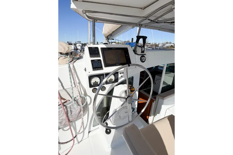No Ka Oi Yacht Photos Pics Steering wheel and navigation instruments on 2005 Lagoon 380 S2 catamaran.