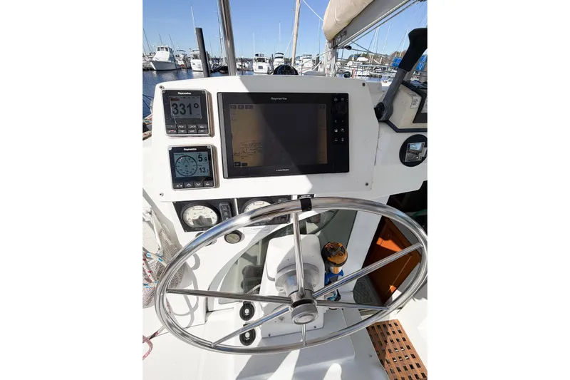 No Ka Oi Yacht Photos Pics Steering wheel and navigation instruments on 2005 Lagoon 380 S2 catamaran.