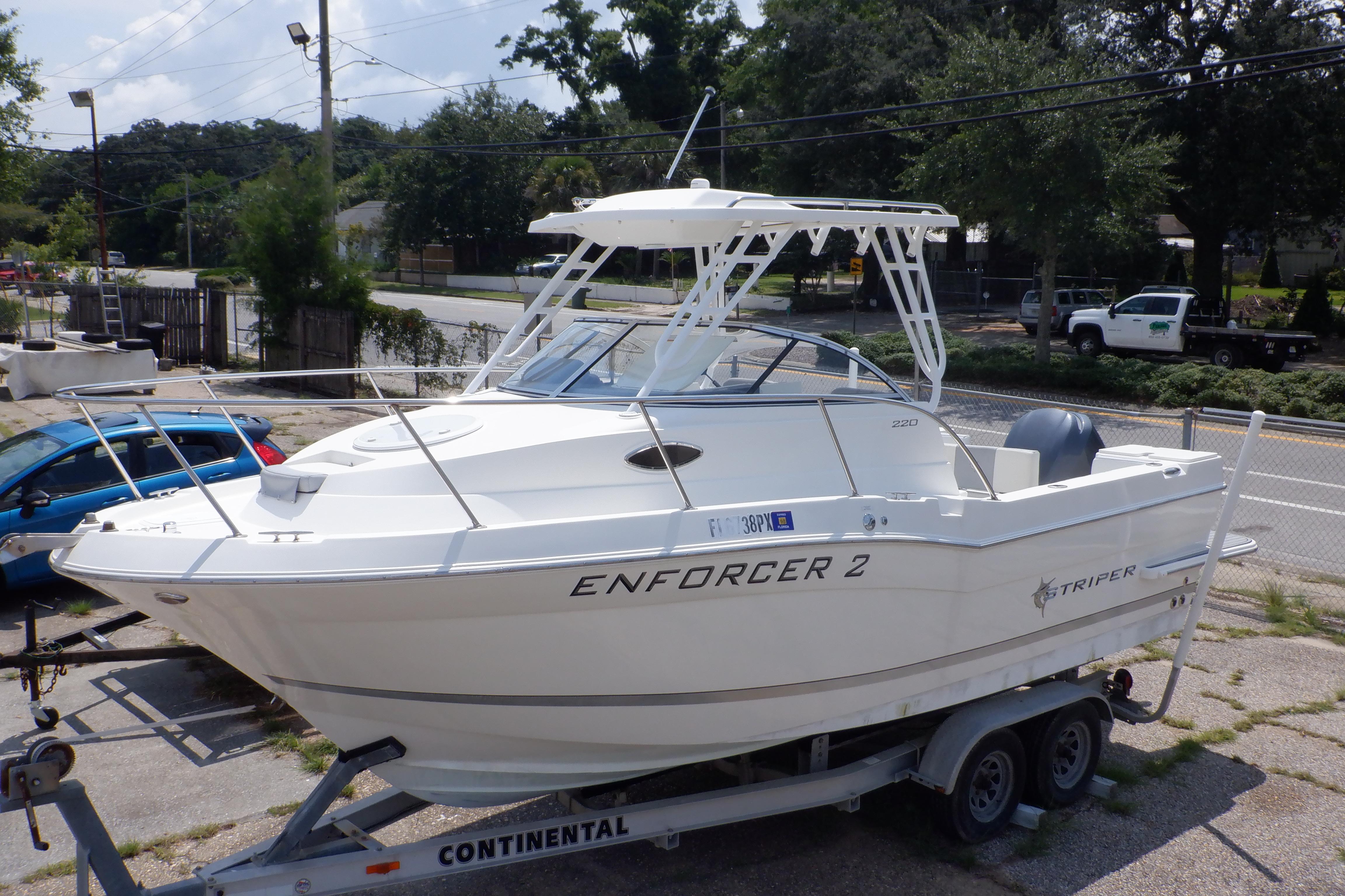 2015 Seaswirl Striper 220 Walkaround boat on trailer, labeled "Enforcer 2."