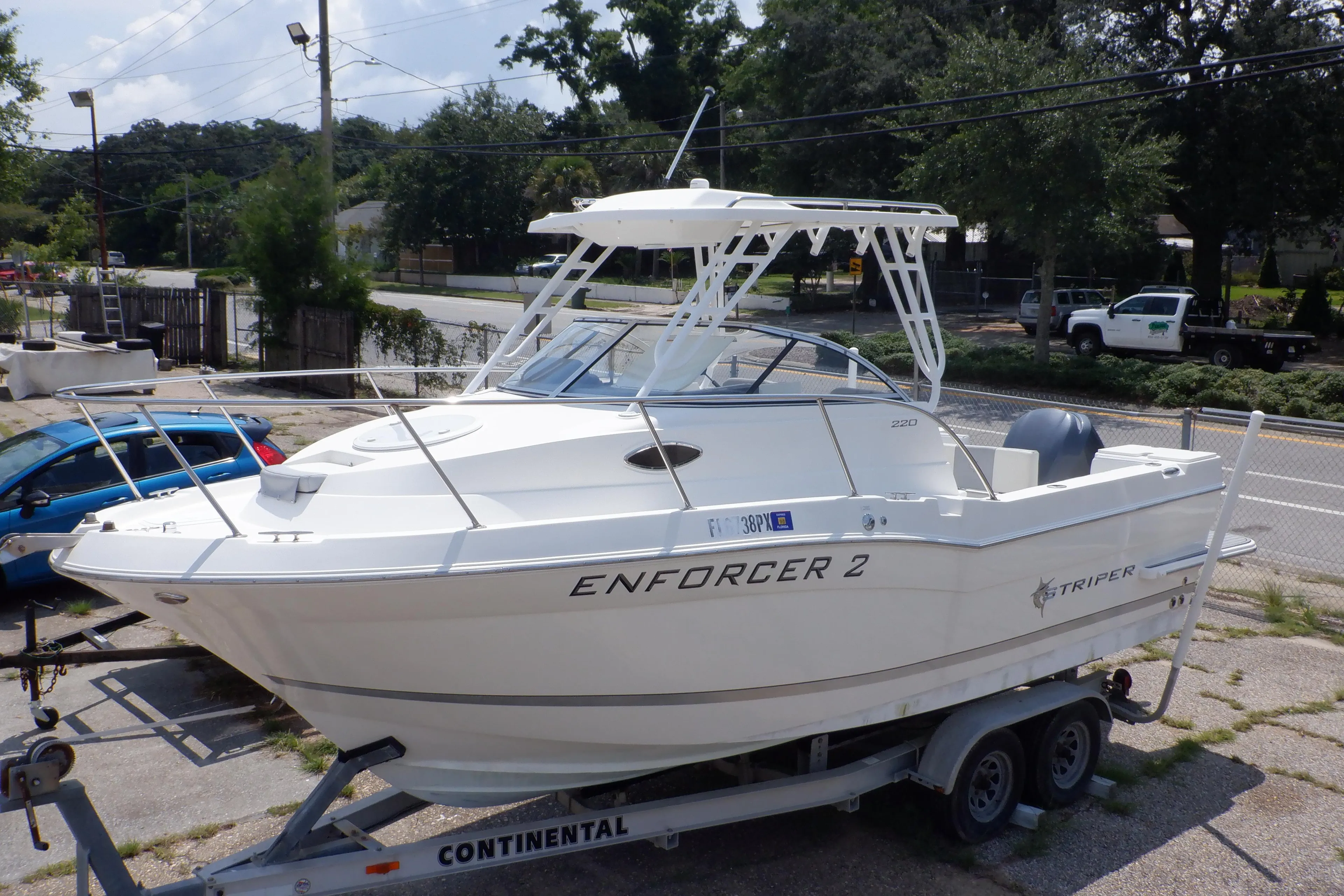 2015 Seaswirl Striper 220 Walkaround boat on trailer, labeled "Enforcer 2."